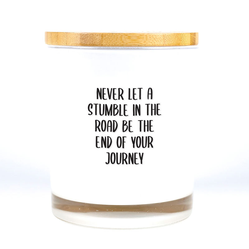 Our timeless and classic Signature Candles provide any home with a beautiful decor item while filling the room with a beautiful fragrance! These vessels also serve as a base for all our printed affirmation designs and are 100% Soy Based. Never Let a Stumble In The Road Be The End Of Your Journey Candle was created to inspire our customers with a meaningful quote so they can be reminded to stay positive throughout the day.