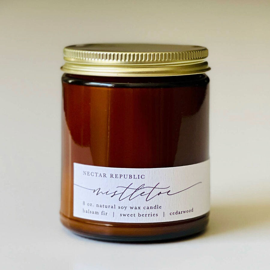 This classic mistletoe scented jar candle is the perfect holiday gift for someone special Infused with the familiar aromas of festive fruits and greenery this vegan soy Mistletoe Candle smells perfect for any Christmas party or holiday gathering