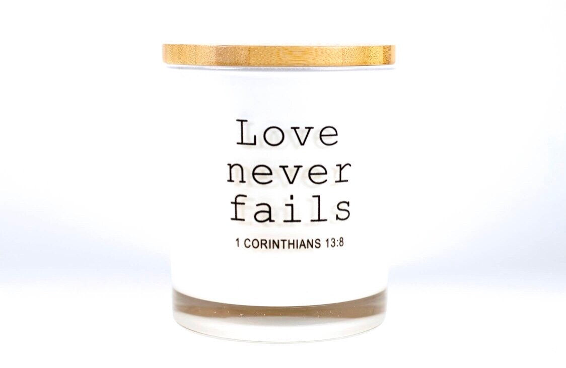 Our timeless and classic Signature Candles provide any home with a beautiful decor item while filling the room with a beautiful fragrance! These vessels also serve as a base for all our printed affirmation designs and are 100% Soy Based. Love Never Fails Candle was created to inspire our customers with a meaningful quote so they can be reminded to stay positive throughout the day.
