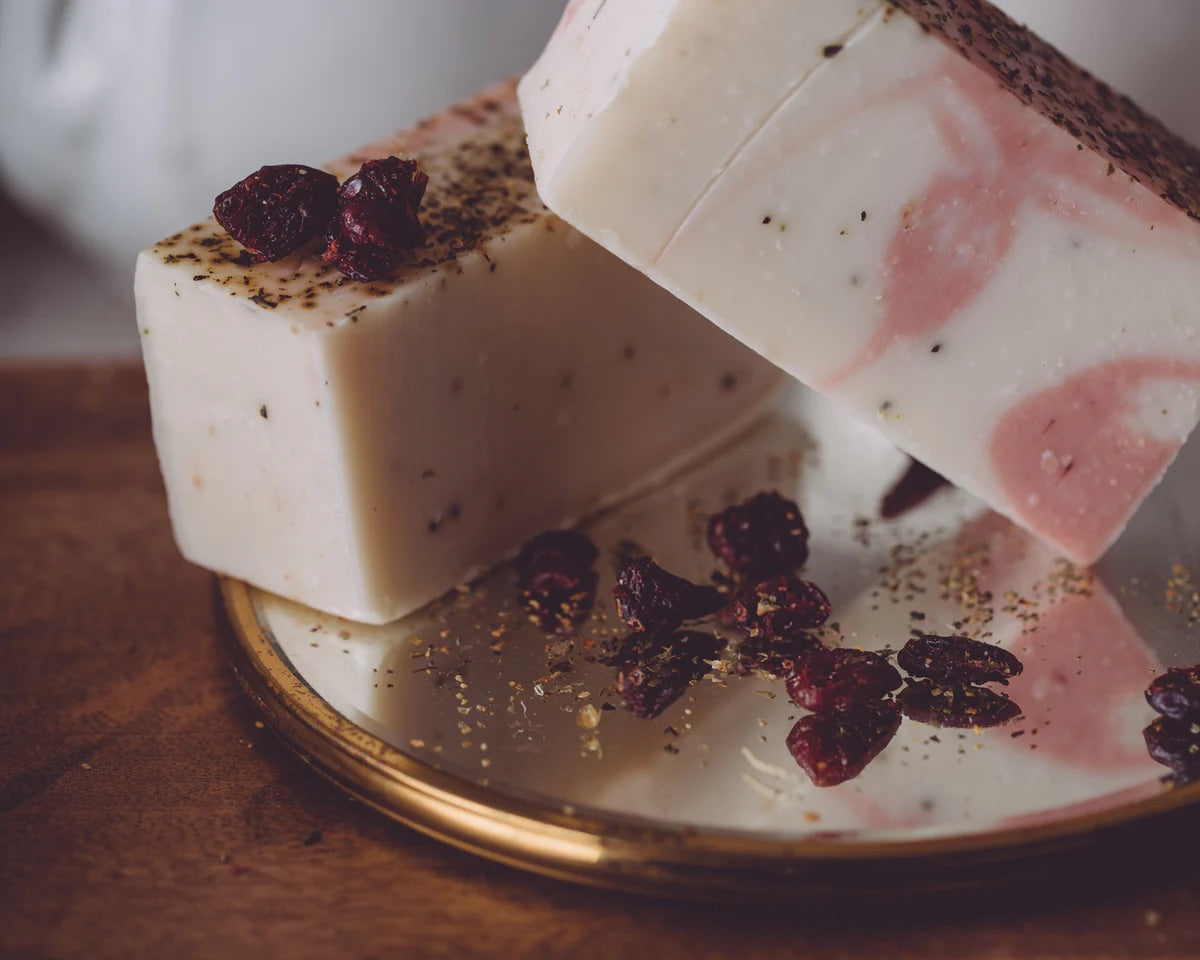 Our Cranberry Soufflé Organic Soap is fresh, clean, and tantalizing. This organic handmade soap contains crushed Rose Hips, Juniper Berries, Hibiscus Flower, Myrtle Leaf, and Blackberries.